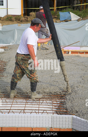 Pouring a ready mix of concrete. Stock Photo