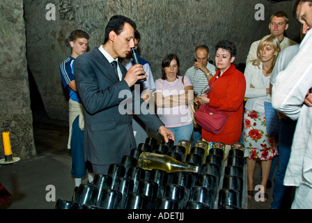 Reims France, Champagne Company 'Veuve Clicquot Ponsardin' Tourists Visiting Champagne Cave Tourism, Cellar, Tour Guide leading groups , Explaining Stock Photo