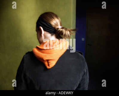 Woman going though a corridor Stock Photo