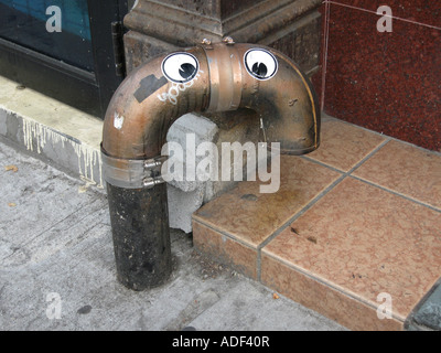 Fire stand pipes with eyes in New York City Stock Photo