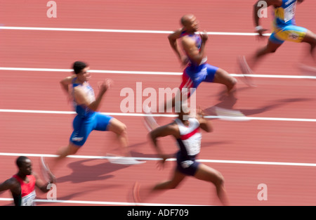 sprinters speeding down the track towards the finish line Stock Photo