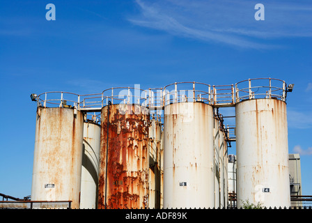 Corroded and corroding chemical storage vessels in a chemical plant complex Stock Photo