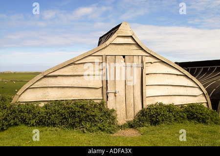 Boat shaped buildings in Lindisfarne in North East England Stock Photo