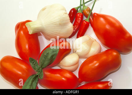 Onion tomatoes basil garlic chilli peppers Italy Stock Photo
