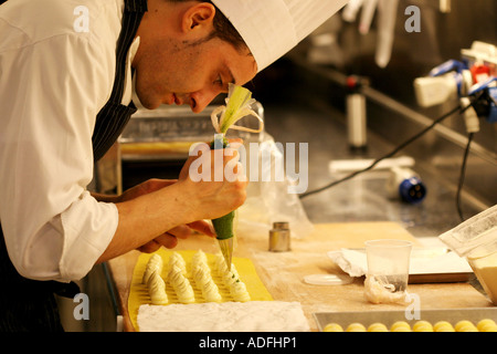 Preparation of Ravioli pasta with maionese and Salsa Verde sauce Cracco Peck restaurant Milan Lombardy Italy Stock Photo