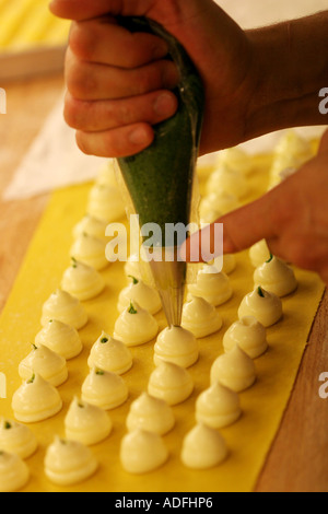 Preparation of Ravioli pasta with maionese and Salsa Verde sauce Cracco Peck restaurant Milan Lombardy Italy Stock Photo