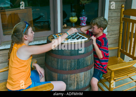 Two kids playing checkers Stock Photo
