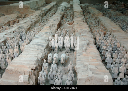 Rows of terracotta warriors in pit number one at the museum in Xian The areas at the far side are yet to be unearthed  Stock Photo