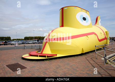 Yellow submarine parked outside John Lennon Airport in Liverpool, song by Ringo Starr from the album 'Revolver' Stock Photo