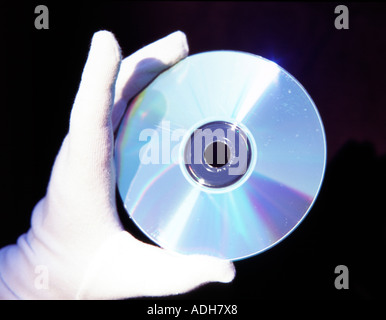 Hand holding cd-rom. Stock Photo