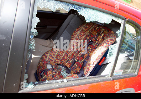 Smashed rear passenger window with broken glass Stock Photo - Alamy