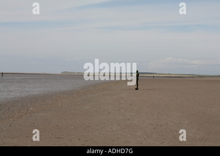 Anthony Gormley Another Place a series of figure sculptures on the beach at Crosby near Liverpool merseyside england Stock Photo