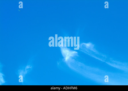 White Cirrus Clouds High in a Blue Sky Over Cheshire England Stock Photo