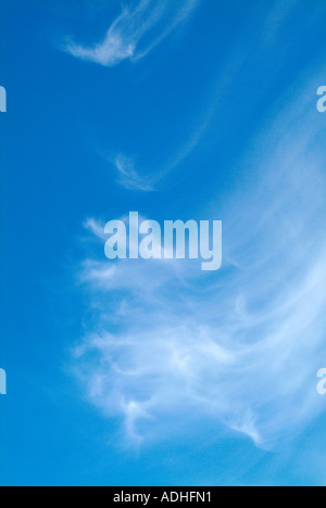 White Cirrus Clouds High in a Blue Sky Over Cheshire England Stock Photo