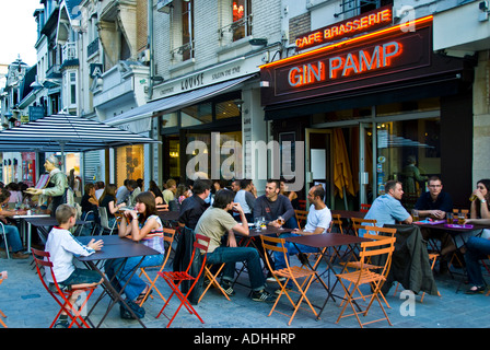 Reims France, Crowd of Young People Drinking, French Brasserie Bar Cafe Restaurant Outdoor Terrace 'Gin Pamp' sidewalk Stock Photo