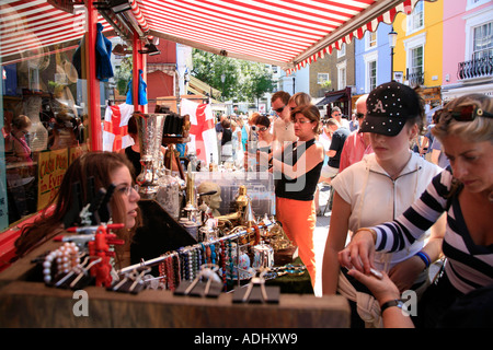 Buying souvenirs in the Portobello Road Market in London Stock Photo