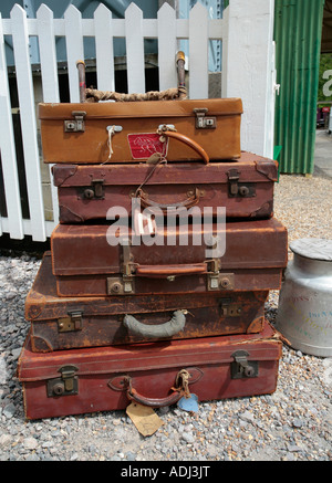 A stack of vintage leather suitcases at Amberley Working Museum, Amberley, West Sussex, UK Stock Photo