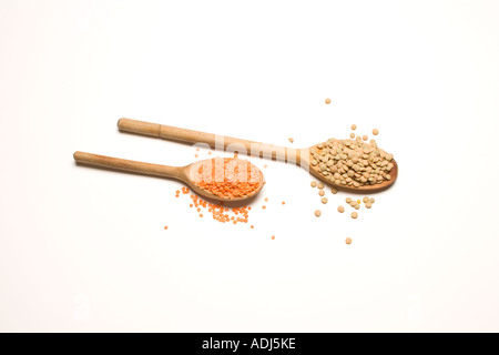 Lentils on wooden spoons Stock Photo