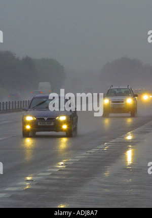 Car headlights in the dark in the rain close up Stock Photo - Alamy