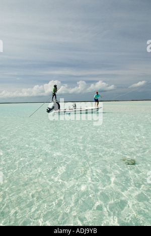 GREATER EXUMA BAHAMA Fly fisherman casting for Bone -Fish in Emerald Green Waters. Stock Photo