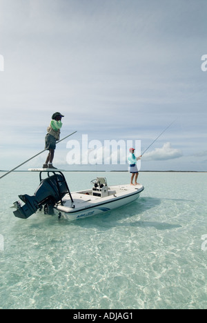 GREATER EXUMA BAHAMA Fly- Fisherman Bone Fishing in Emerald Waters. Stock Photo
