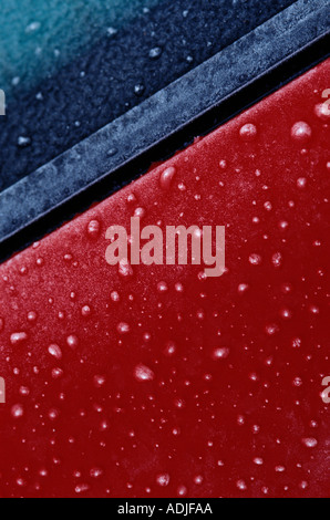 Frozen raindrops on a red car Stock Photo