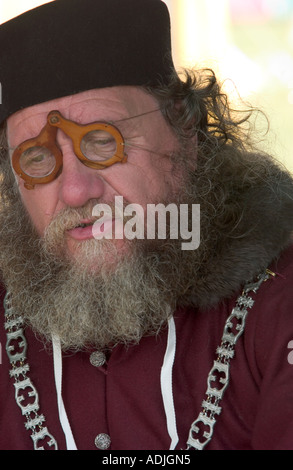 medieval man wearing glasses in costume Stock Photo