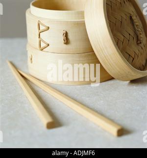 Bamboo steamer and bamboo chopsticks Stock Photo