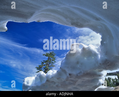 Snow cave carved by water Mt Lassen Volcanic National Park California Stock Photo