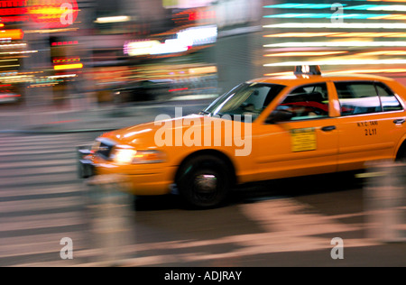 New York City Yellow Cab / Taxi moving fast along Broadway, Times Square Stock Photo