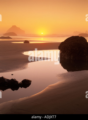 Sunset and fog at low tide Bandon Beach Oregon Stock Photo