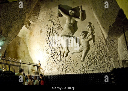 Reims France, Wall Art, Champagne Company 'Veuve Clicquot Ponsardin' Champagne Tourists Visiting Cave With Large Bas Relief Carved on Cellar Wall Stock Photo