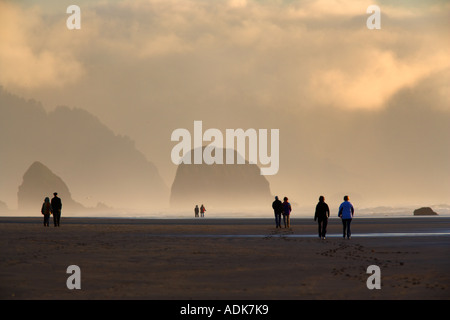 Couples walking on Cannon Beach Oregon Stock Photo