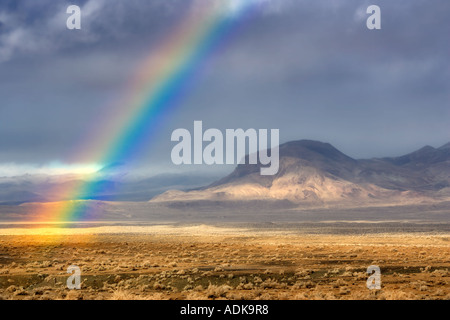 Rainbow with mountains Black Rock Desert National Conservation Area Nevada Stock Photo