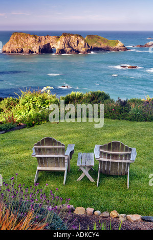 Two chairs on grass overlook at The Harbor House Inn Elk California Stock Photo