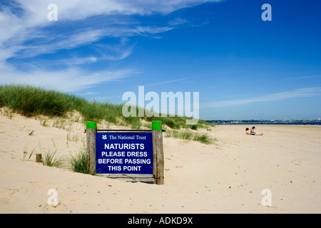 Naturists Sign on sandy Beach at Studland, Isle of Purbeck, Dorset, UK Stock Photo