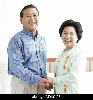 an old couple holding each other s hands Stock Photo