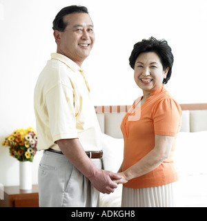 an old couple holding each other s hands Stock Photo