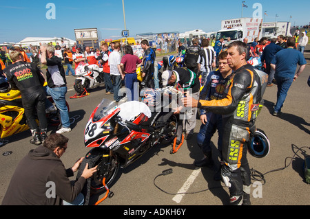 Contestants prepare bikes on starting grid between Portrush Portstewart in annual international 'North West 200' motorcycle race Stock Photo