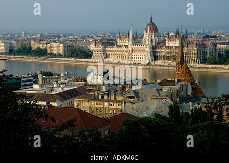 evening falls on the Hungarian parliment building across the Danube River in Budapest Hungary Stock Photo