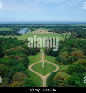 Holkham Hall and parkland with monument Norfolk UK aerial view Palladian mansion home of Lord Leicester Stock Photo