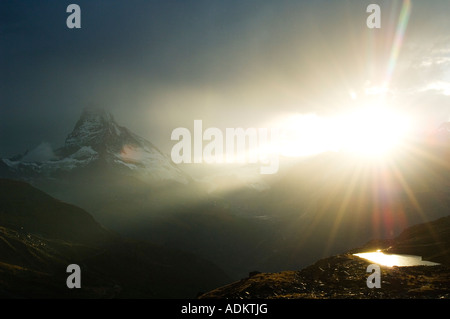 Switzerland The Valais Zermatt Alpine Resort The Matterhorn 4477m Sun breaking through Clouds of an Afternoon Storm Stock Photo