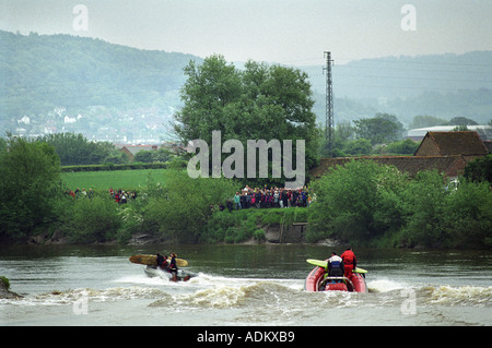 SURFERS RIDING THE SEVERN BORE NEAR EPNEY GLOUCESTERSHIRE UK Stock Photo