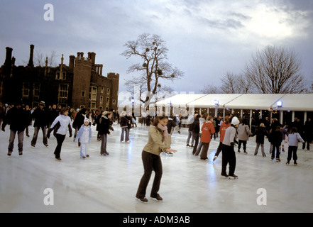 Ice Skaters at Hampton Court Palace Seasonal Ice Rink December East Molesey Surrey England Stock Photo