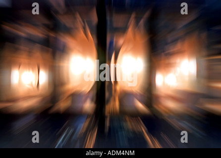 A zoomed abstract of a stained glass, candle bulb chandelier. Stock Photo