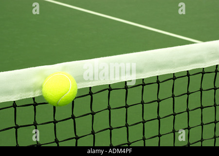 Tennis ball on court Stock Photo