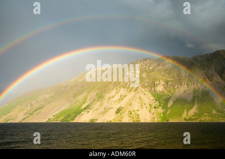 Rainbow over Wast Water looking towards the scree slopes of Illgill Head Lake District National Park Cumbria England Stock Photo