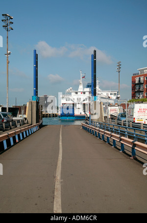 Isle of Wight car ferry approaching dockside in Portsmouth Harbour, Hampshire, UK Stock Photo