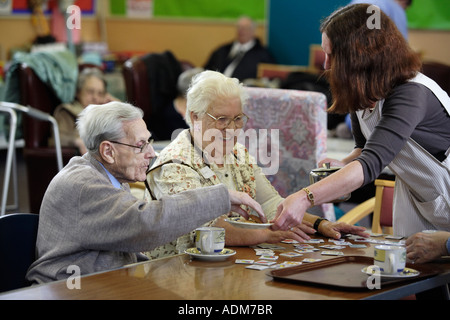 Tea and biscuits being served at an Age Concern Centre in the West Midlands, UK Stock Photo