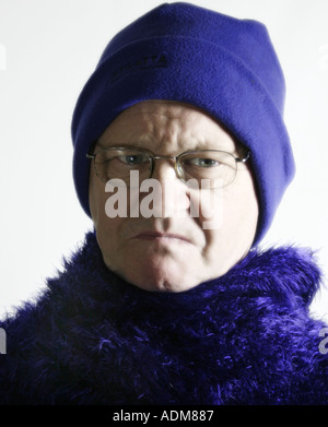 Man in his sixties wears purple Stock Photo